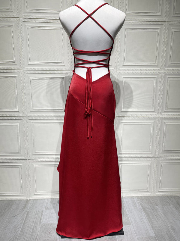 Halter dress with a ruffled, irregular hem.