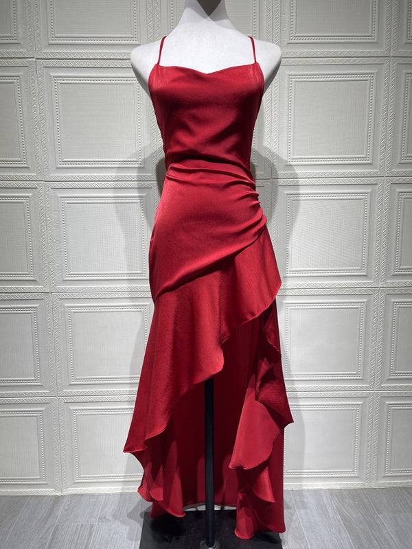 Halter dress with a ruffled, irregular hem.